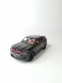 Коллекционная машинка игрушка металлическая BMW XM для мальчиков масштабная модель 1:24 черная матовая
