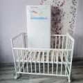 Кроватка Kristi колесо качалка + матрас MAGIC