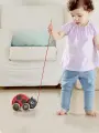 Каталка деревянная детская на веревочке Hape Божья коровка, E0362_HP