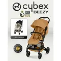 Коляска Cybex Beezy Cinnamon Yellow 2026 с бампером и дождевиком