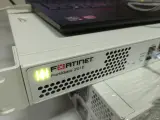 Межсетевой экран FORTINET FortiGate 201E FG-201E 18x GE RJ45 (including 2x WAN ports, 1x Mgmt port, 1x HA port, 14x switch ports), 4x GE SFP slots, SPU NP6Lite and CP9 hardware accelerated, 480 GB onboard SSD storage.